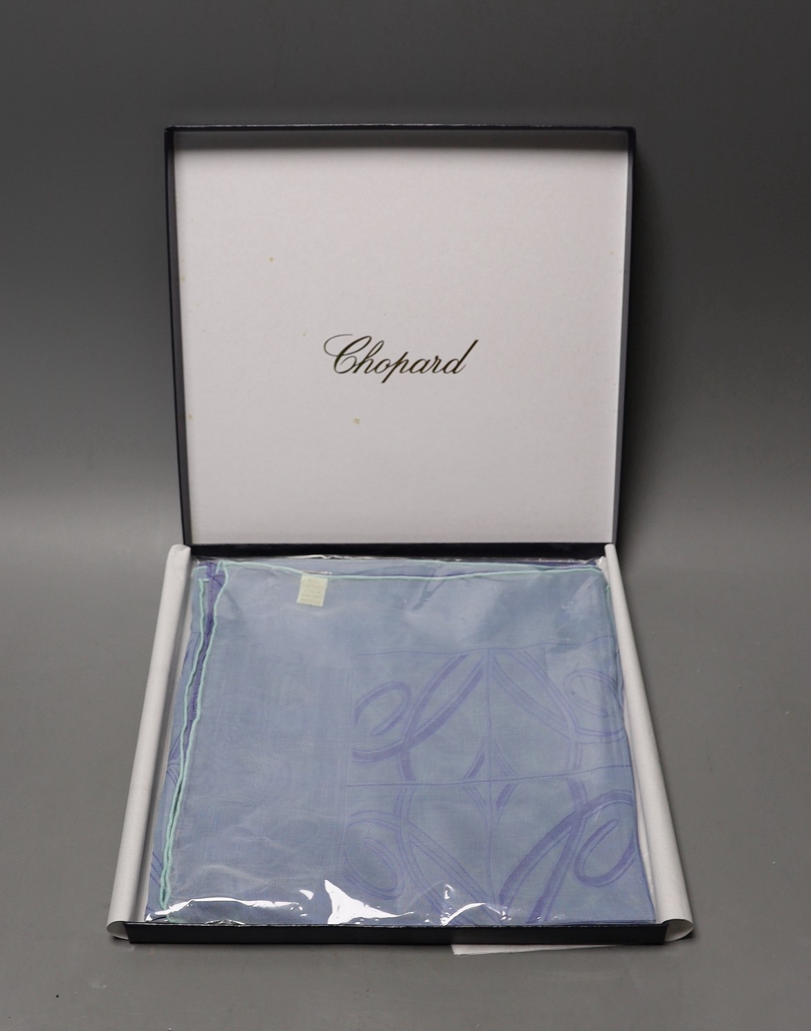 A blue and purple silk Chopard scarf in original box with certificate